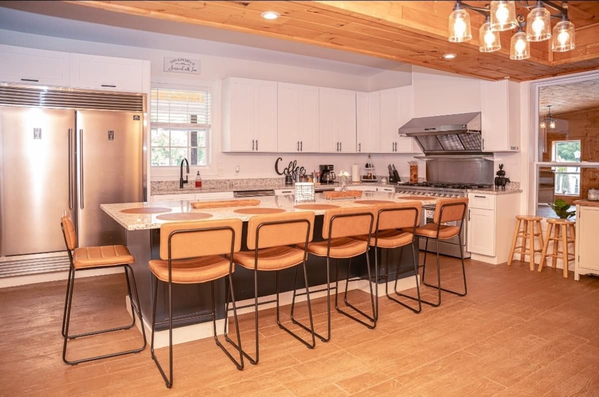 Open kitchen and long island where the group eats together