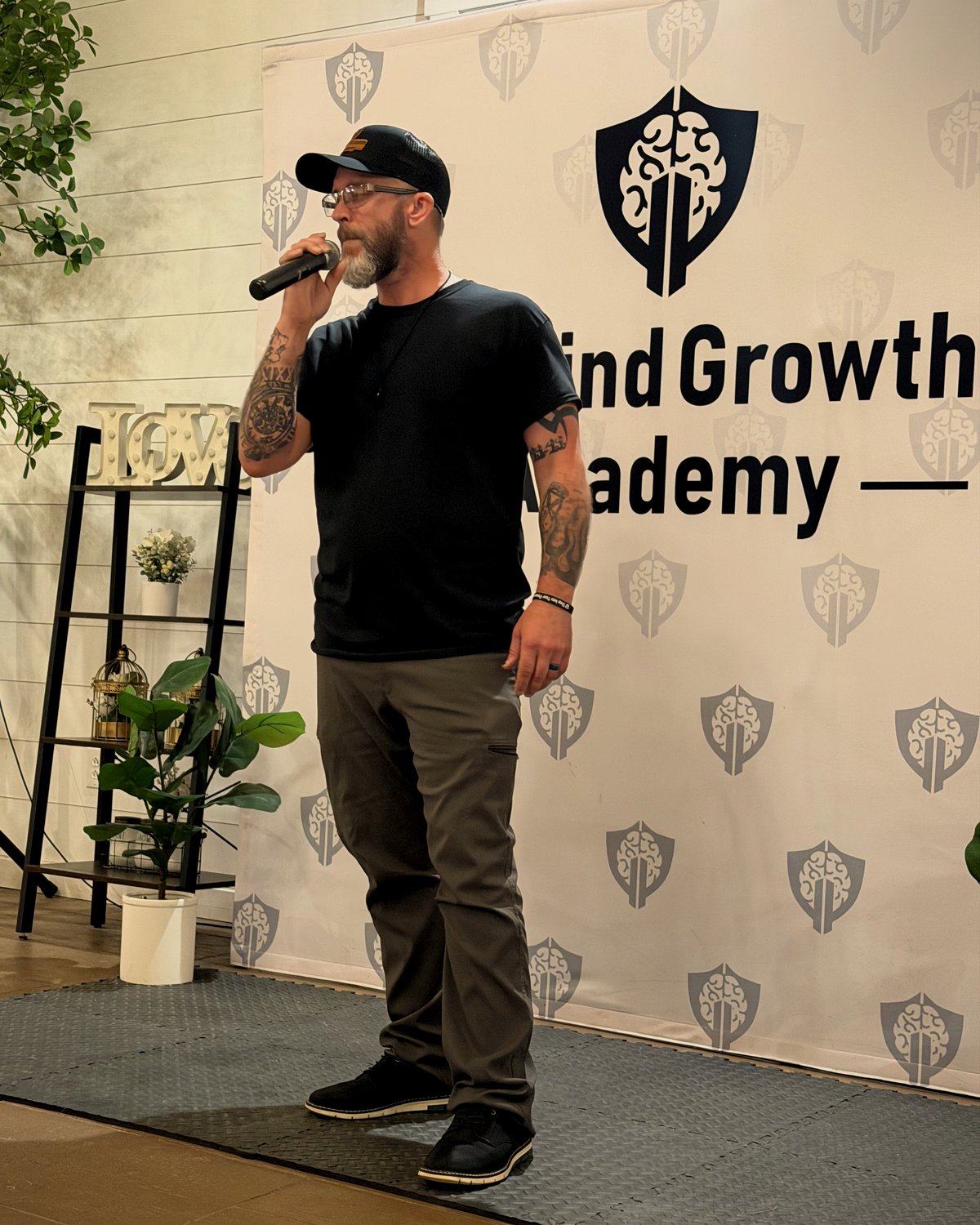 A graduate speaking at a GP Mind Growth Academy training